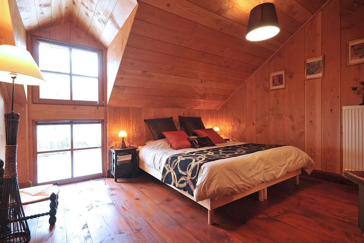 Grange bedroom with double bed and garden view